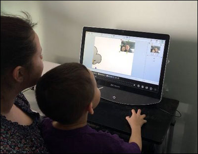 image of parent and child exploring Wixie project at home