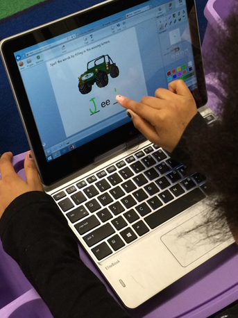 student working in Wixie at phonics station